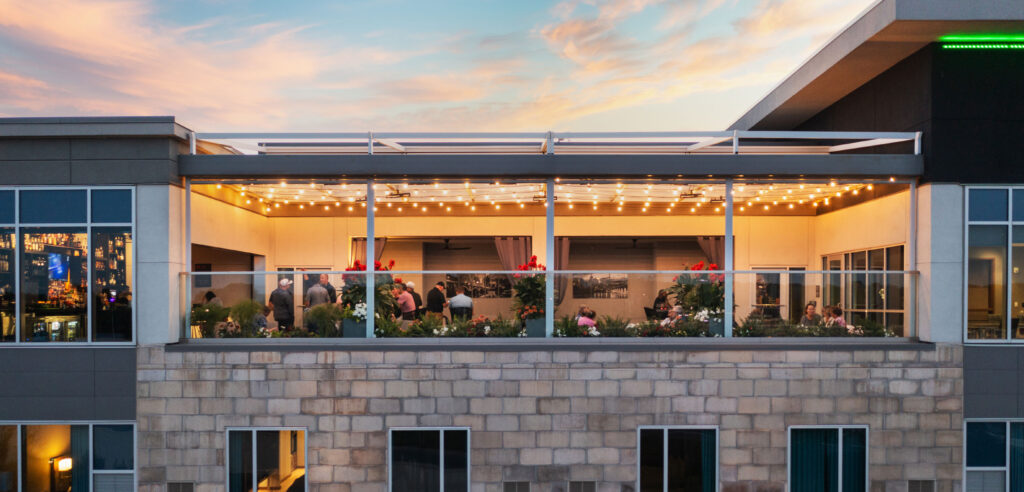 Reveal Rooftop Bar and Lounge Drone Photo at Dusk